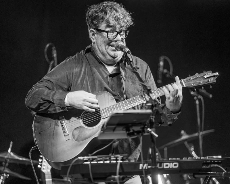 Donny Atkins singing and playing guitar